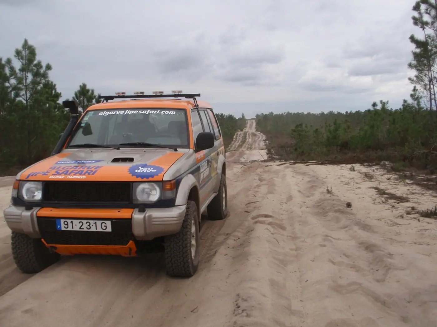 Jeep on a sandy route during a multi-day journey